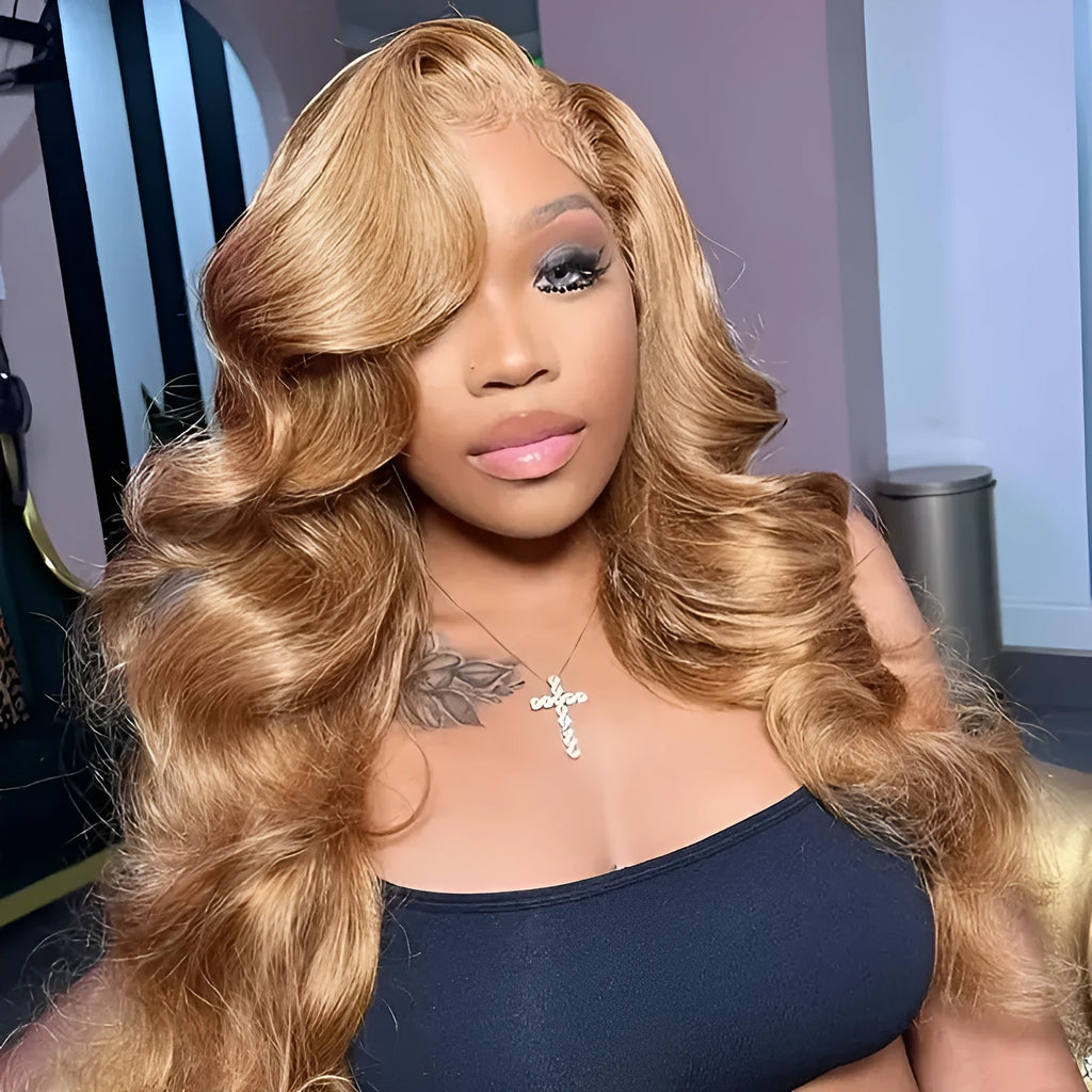 Light brown long curly synthetic wig with big waves and side bangs displayed on a stand.