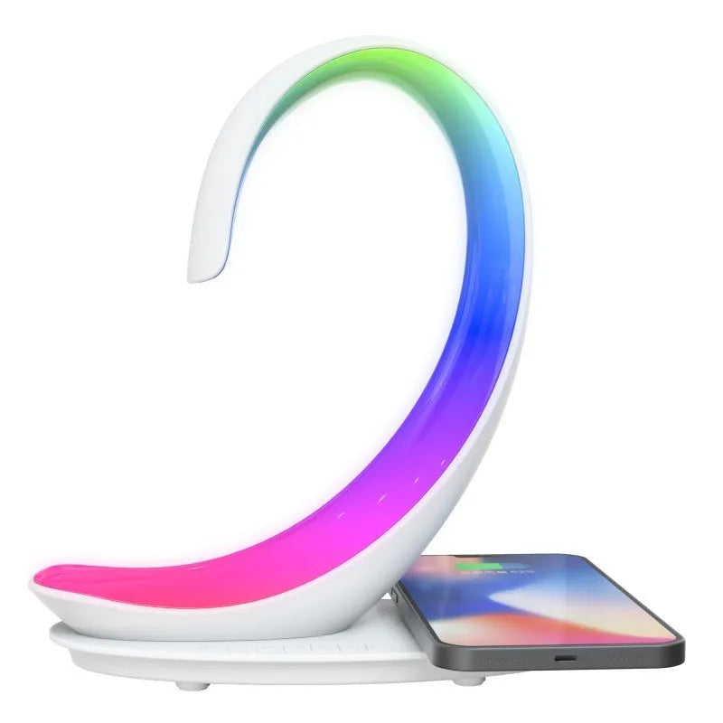 White swan-shaped desktop device with wireless charging, Bluetooth speaker, and colourful mood lighting functions