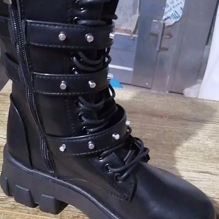 Black women's mid-calf boots with a metal buckle and side zipper on a round toe.