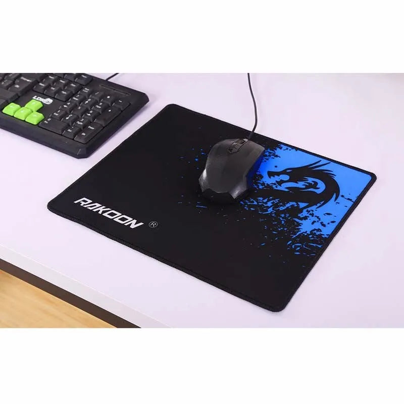 Non-slip mouse pad with textured surface and reinforced stitched edges on a desk