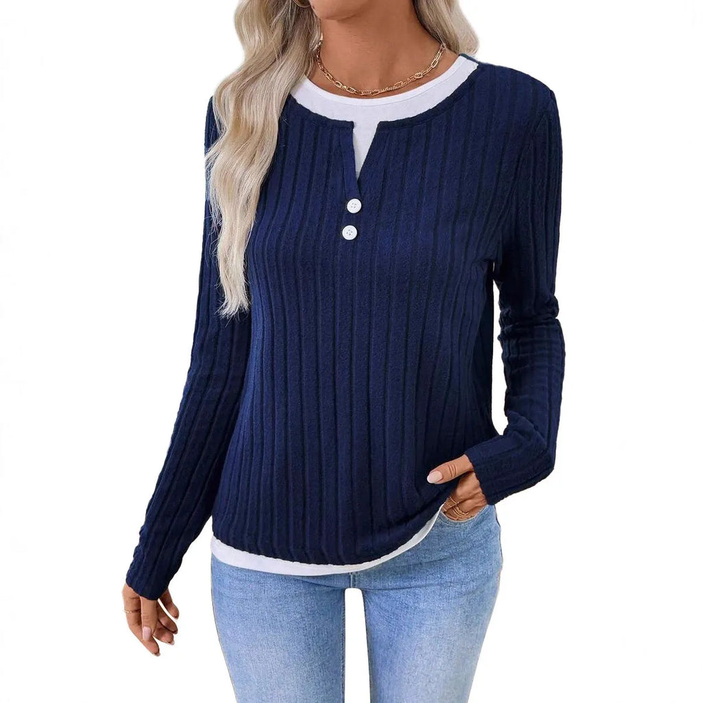 Women's black fake two-piece pullover sweater with round neck button and long sleeves on a model.