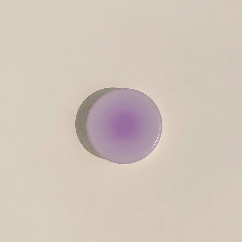 Yellow to purple gradient silicone protective case for iPhone on a table