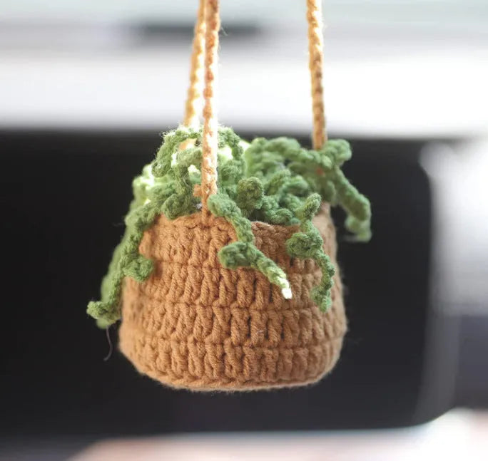 Green and white knitted wool plant ornament for car dashboard with hanging cord