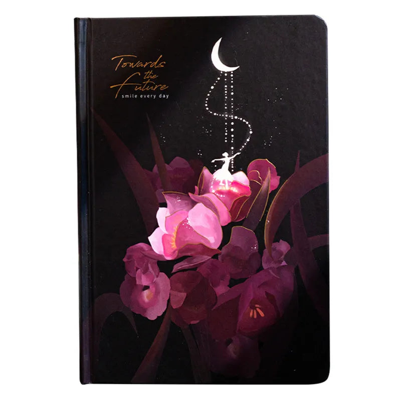 A5 size notebook with a luminous reflective cover, open to show internal pages with colour illustrations.
