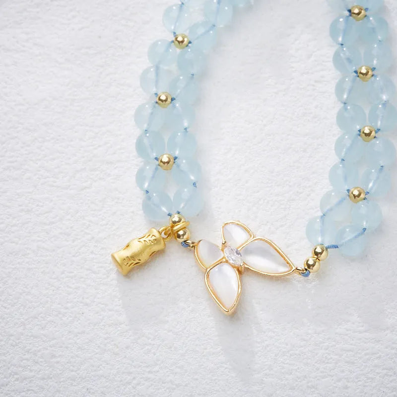 Women's aquamarine butterfly woven bracelet showing 6mm width and retro design detail