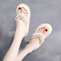 Women's high-heeled flip-flops in beige and black with cotton cloth straps