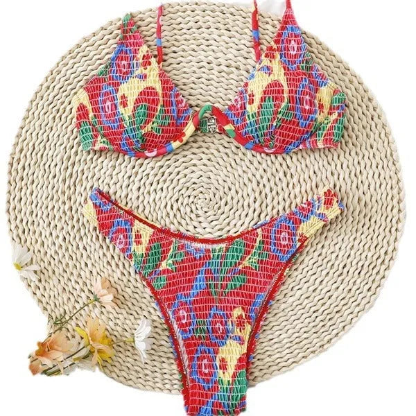 Red floral underwire bikini top and briefs on a white background.
