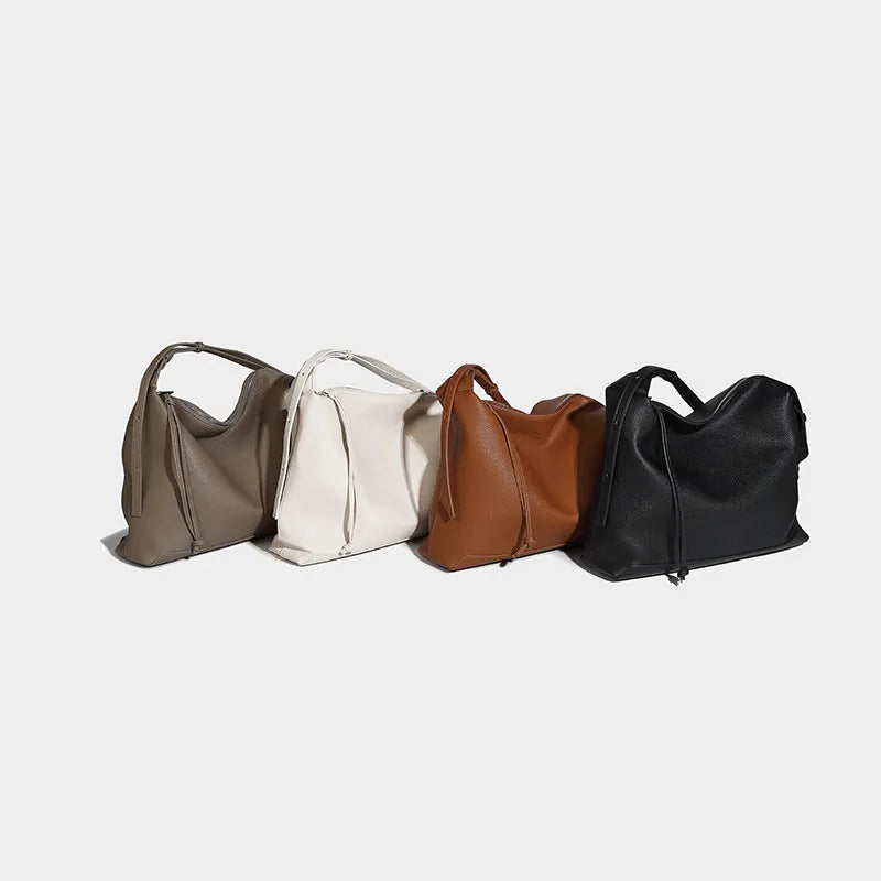 Soft PU messenger bag in caramel colour showing 36cm length and underarm shoulder strap