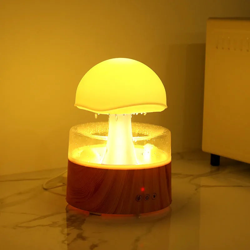 White cloud-shaped humidifier with falling raindrops and colour-changing night light
