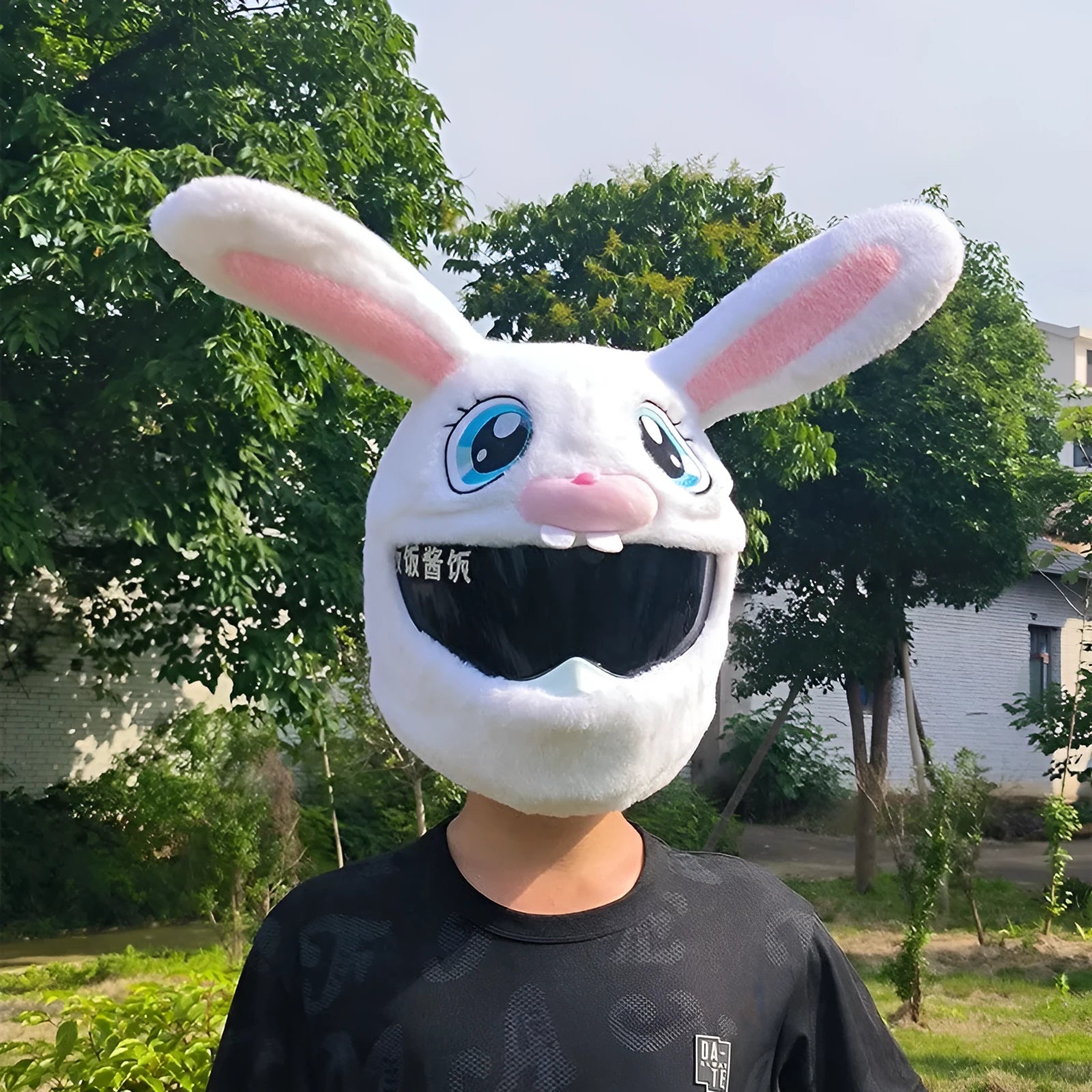 White rabbit plush helmet cover for electric motorcycle with long ears.