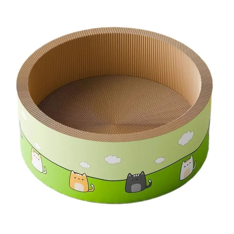 Large round deep pit cat scratch board made of brown corrugated paper on a wooden floor.
