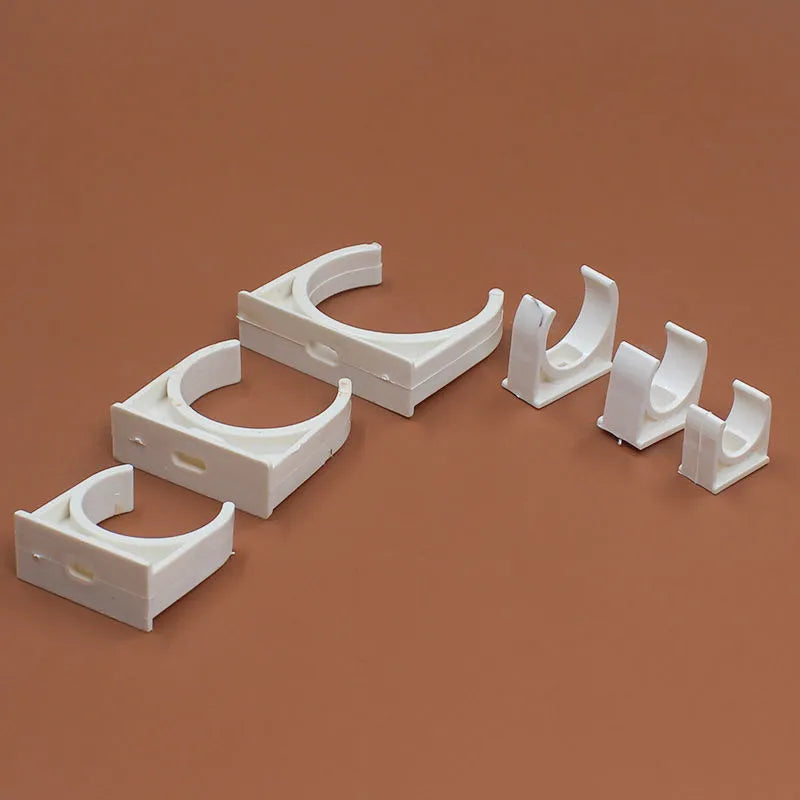 Pack of PVC U-shaped pipe clamps in various sizes for pipe routing