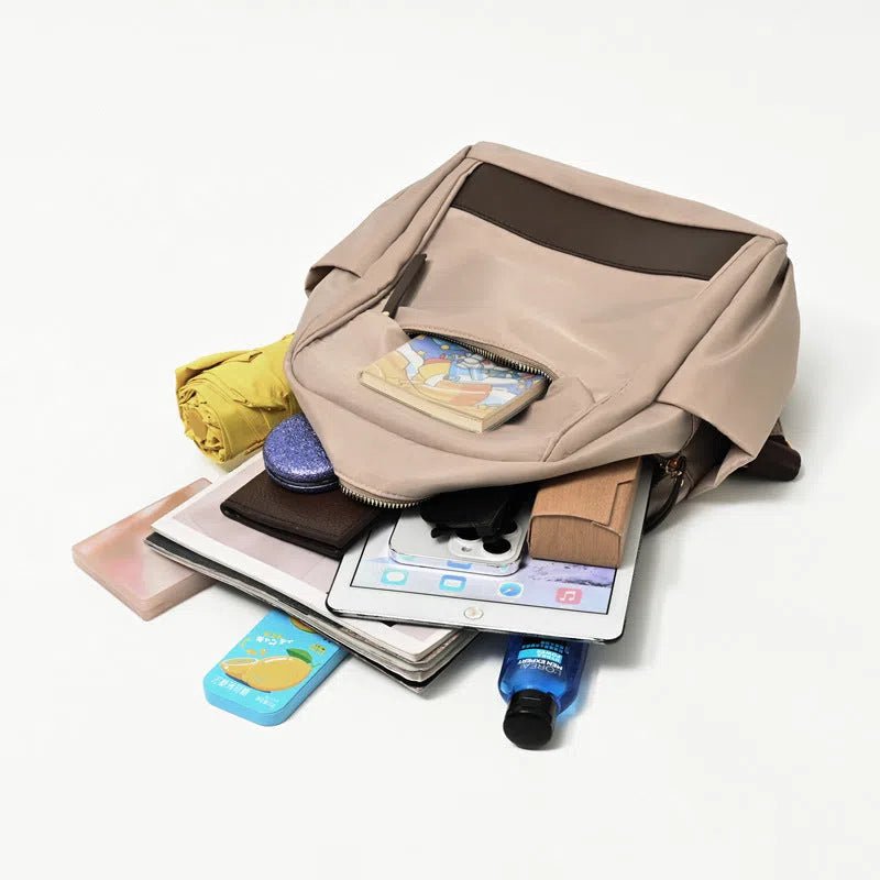 Women's lightweight nylon travel backpack in milk tea colour with large-capacity main compartment