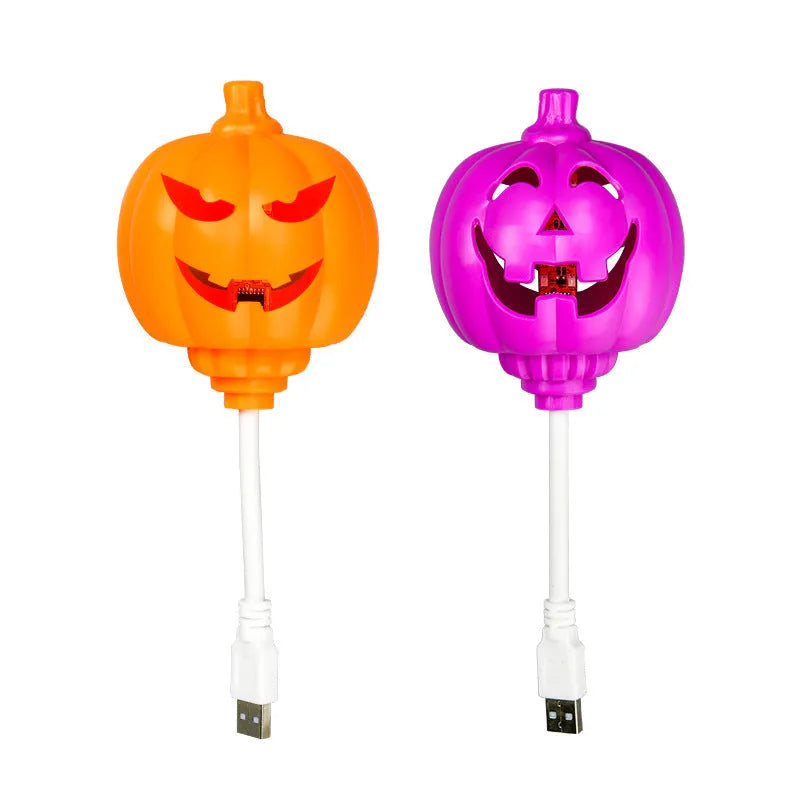 Plastic pumpkin lamp with USB power cable showing yellow or purple light options