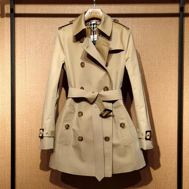Khaki double-breasted trench coat for women with flight sleeves and button details.