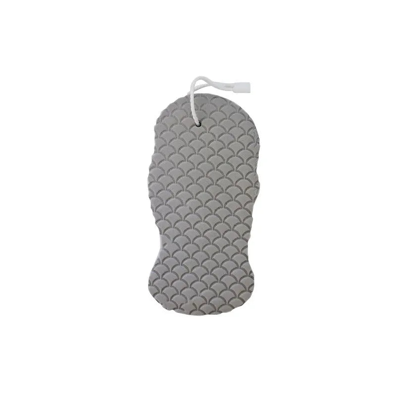 White 3D bath sponge with fish scale pattern for gentle body exfoliation in shower.