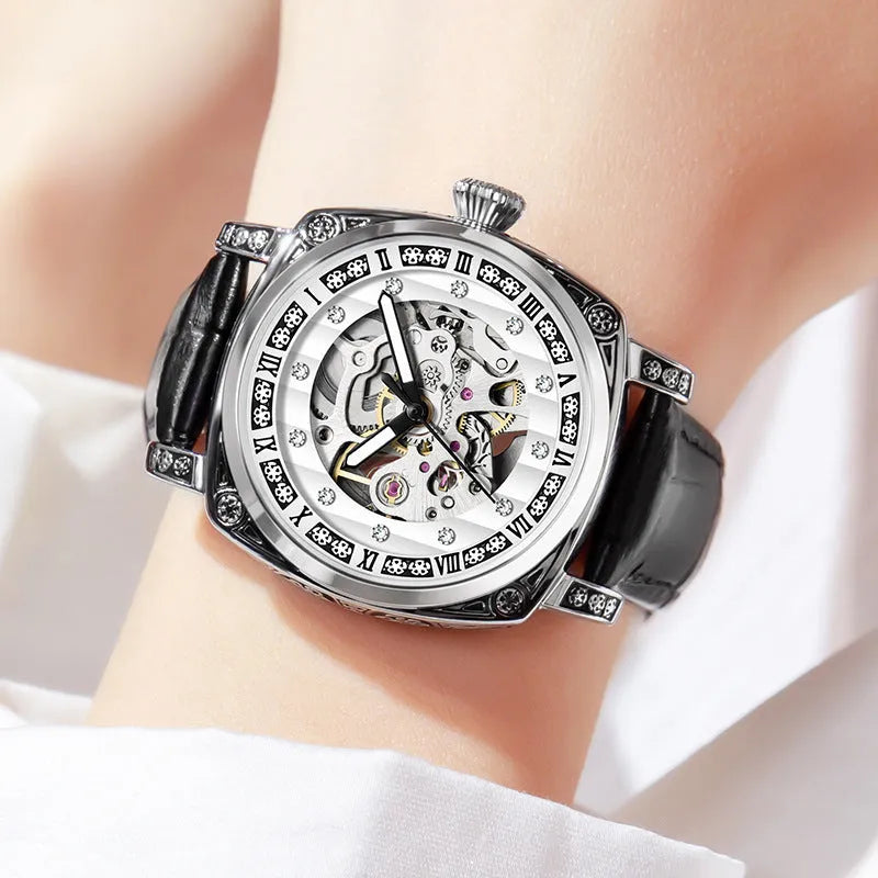 Mechanical wristwatch with luminous dial on a leather strap, shown in multiple colour options.