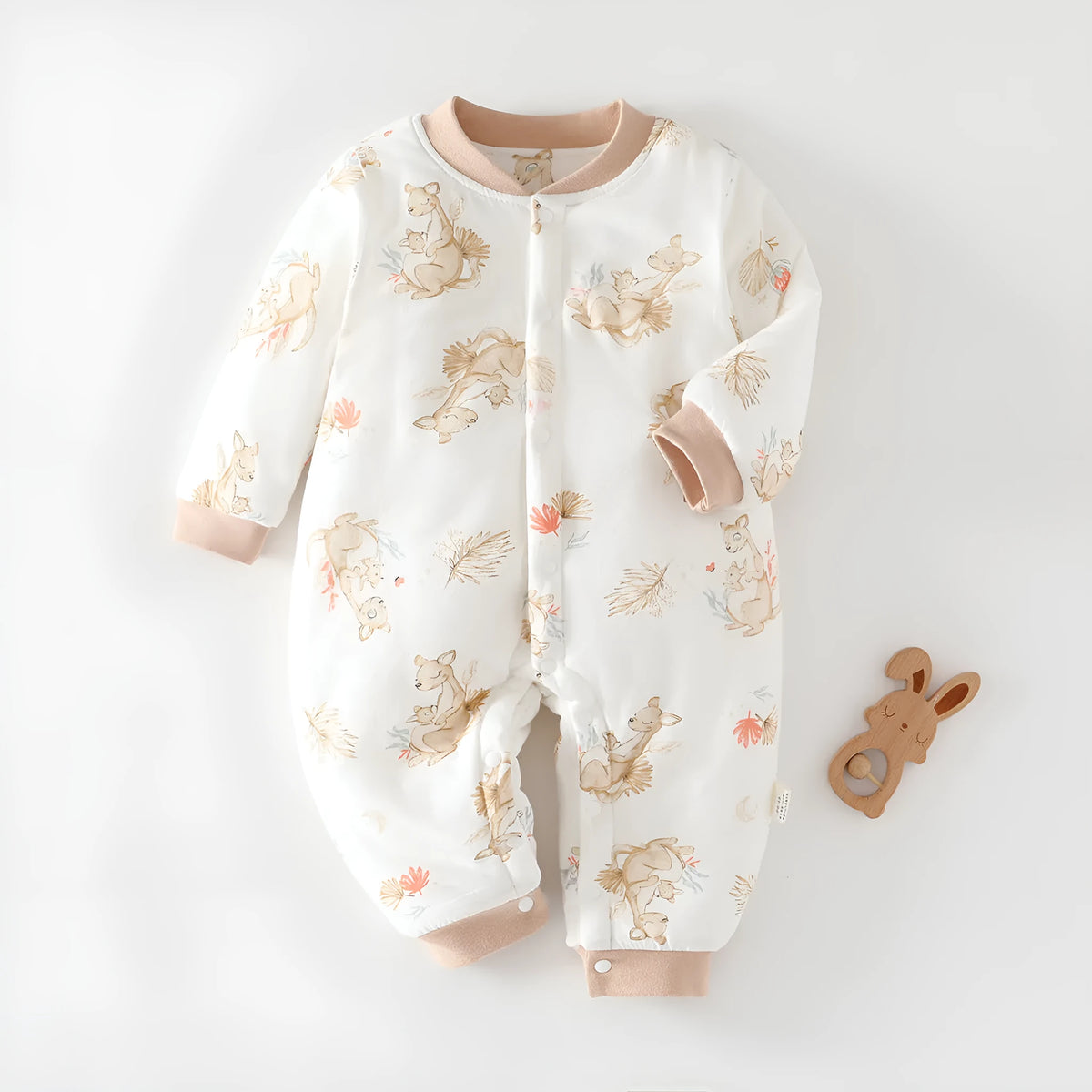 Infant one-piece romper in cotton with closed crotch, long sleeves, and animal-themed colours.