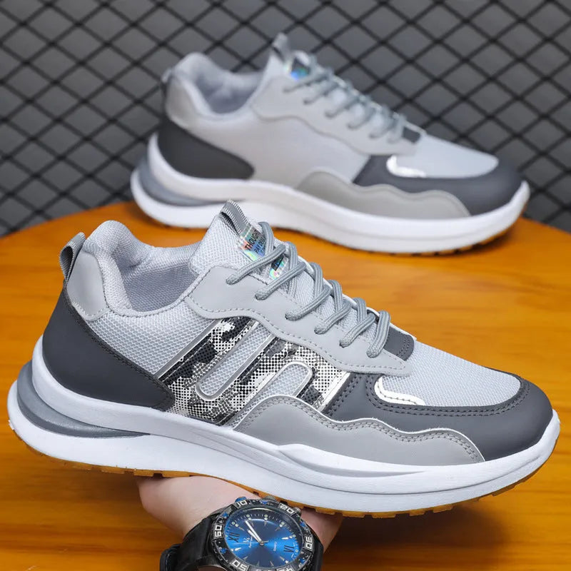 Men's white green and grey mesh casual shoes with a leather toe holder and plastic sole.