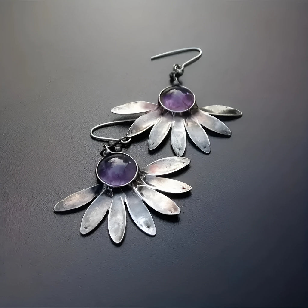 Purple bohemian earrings with resin gemstone details and animal or zodiac modelling