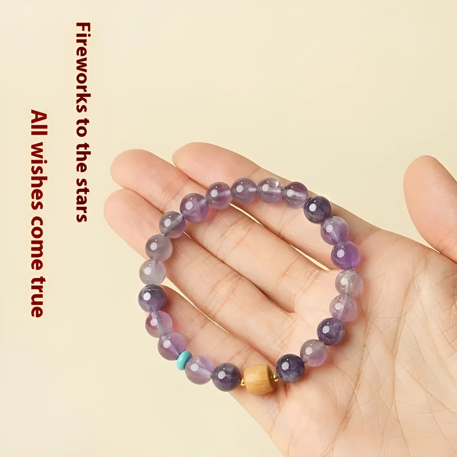 Close-up of a handmade purple amethyst crystal bracelet for women, showing smooth round beads.