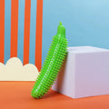 Green cucumber-shaped dog chew toy for teething and interactive play.