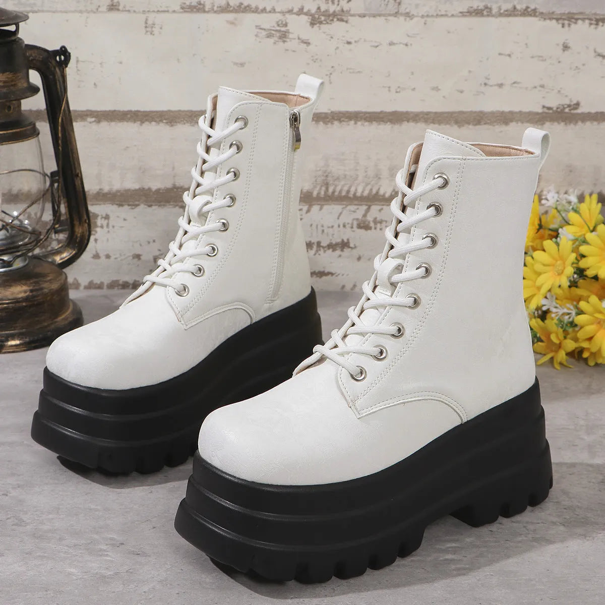 Women's black retro platform Martin boots with chunky heel and side zipper detail.