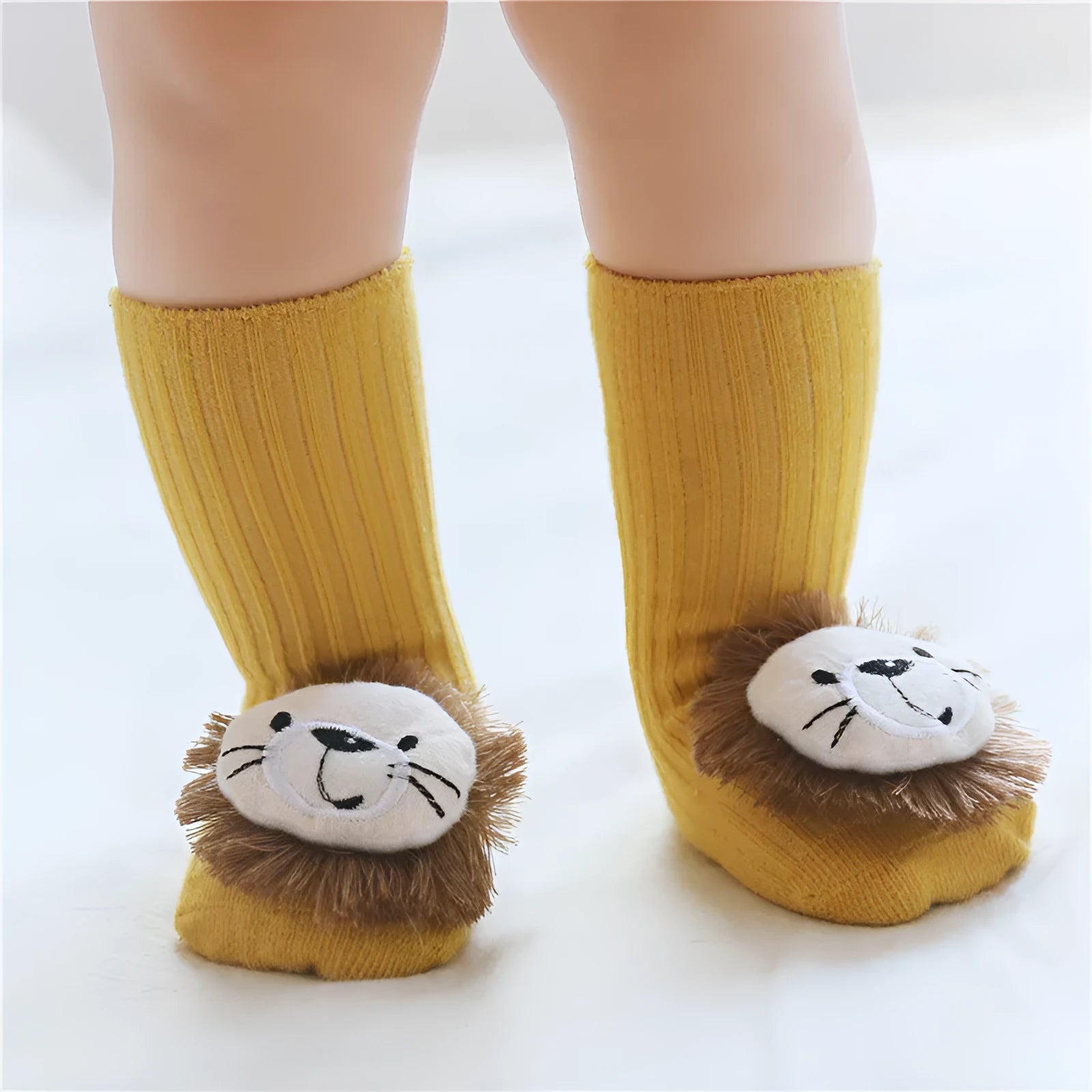 Cotton baby socks with non-slip soles in multiple designs including bows, stars, and animal prints.