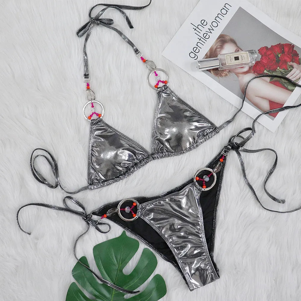 Silver women's bikini swimsuit with split design and briefs style on mannequin