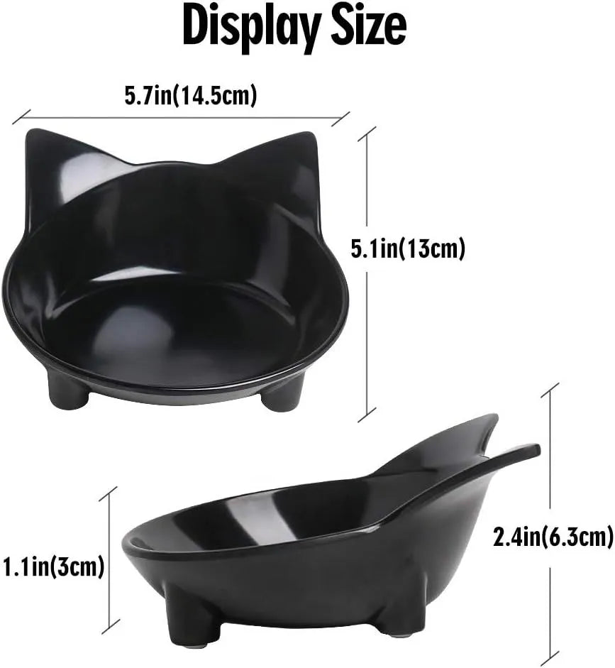A shallow black melamine pet bowl with a non-slip rubber base on a kitchen surface.