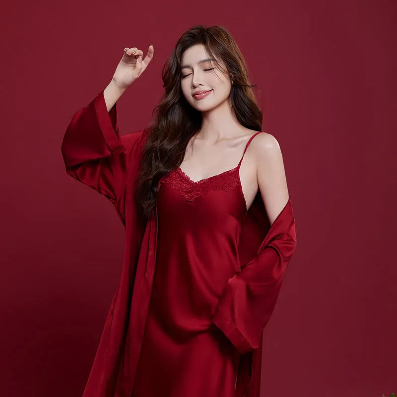 Red matching men's and women's ice silk sleepwear set with long sleeves and trousers.