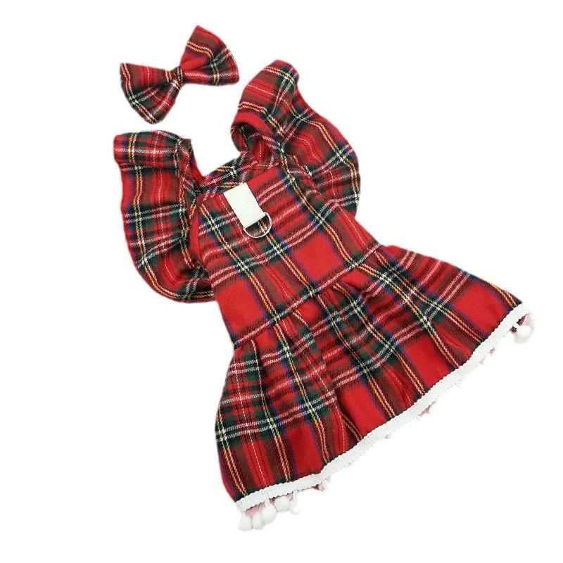 Red tartan Christmas skirt with bow tie and head flower on a dog, showing universal pet festive clothing.