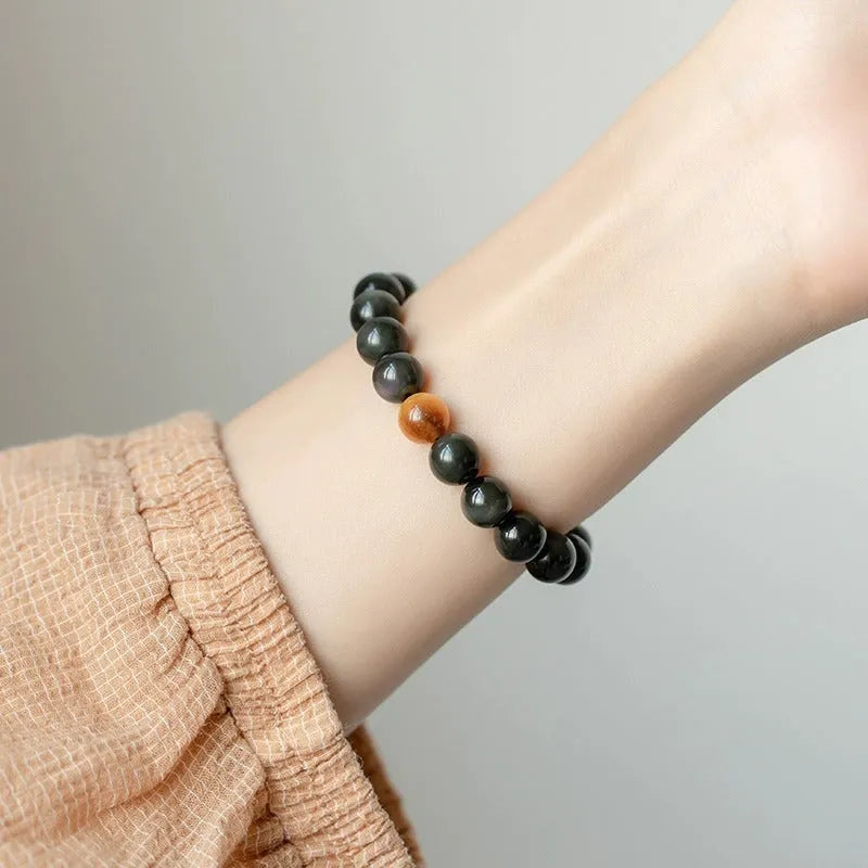 Black geometric obsidian bead bracelet shown in three size options: 6mm, 8mm, and 10mm beads.