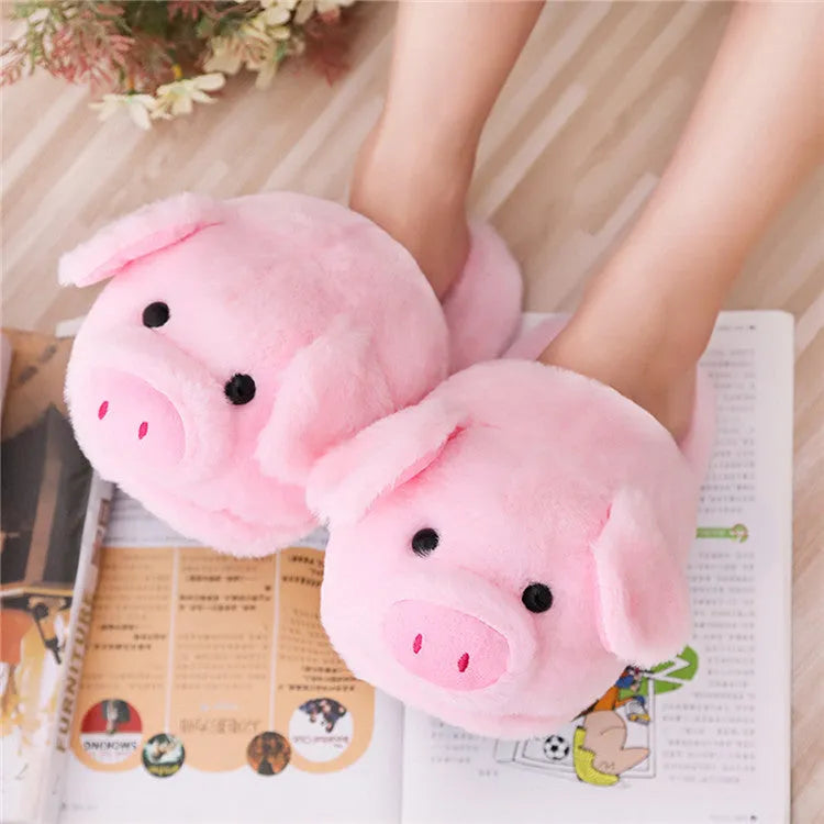 Pink pig-shaped floor slippers made of short plush material.