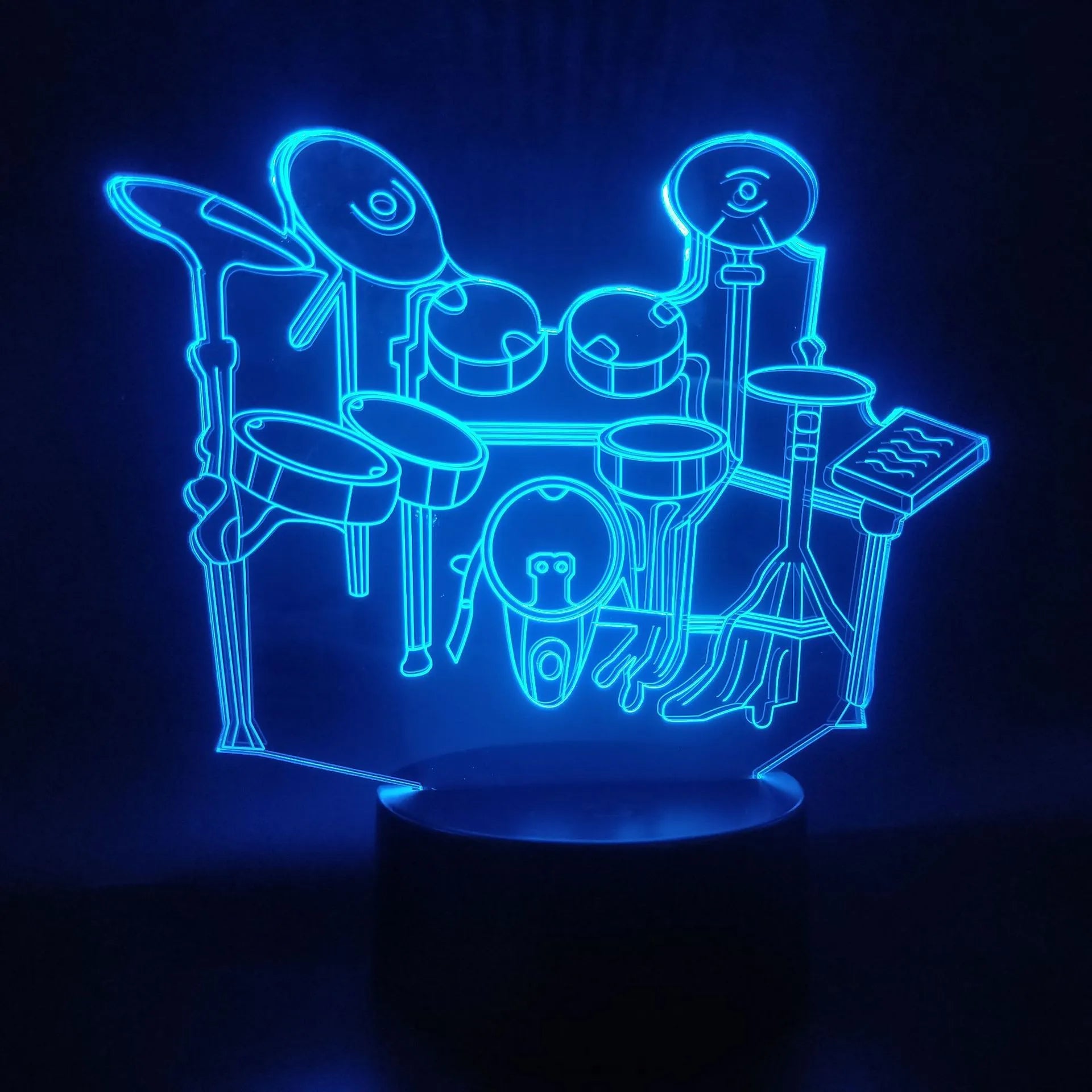 3D acrylic drum kit night light on ABS base with remote control showing colour-changing LEDs