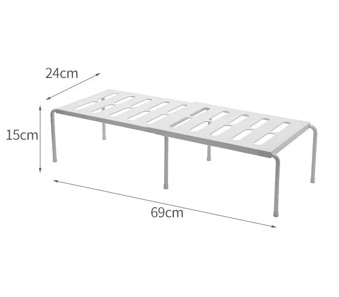 White telescopic plastic kitchen storage rack at adjustable height