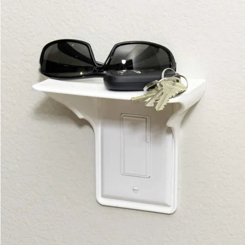 White plastic socket rack organiser for tools on a workbench.