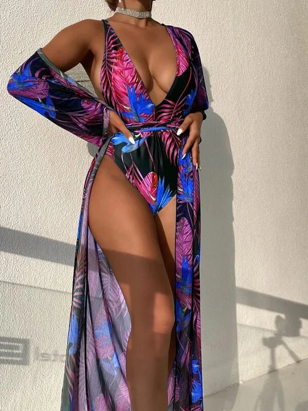 Women's patterned three-piece swimsuit set with bikini and cover-up coat on a mannequin.