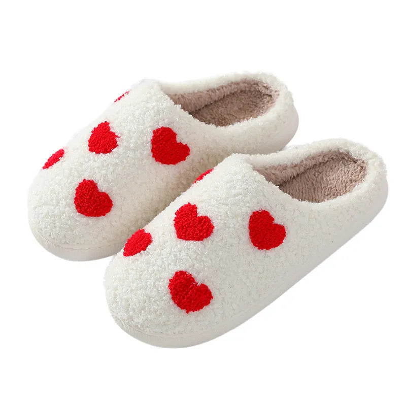 Women's cartoon love style plush slippers in blue smiley colour with round toe and non-slip sole.