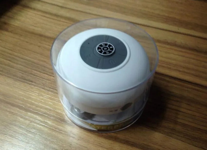 Mini waterproof Bluetooth speaker in blue plastic shell with button controls, 98x88x43mm