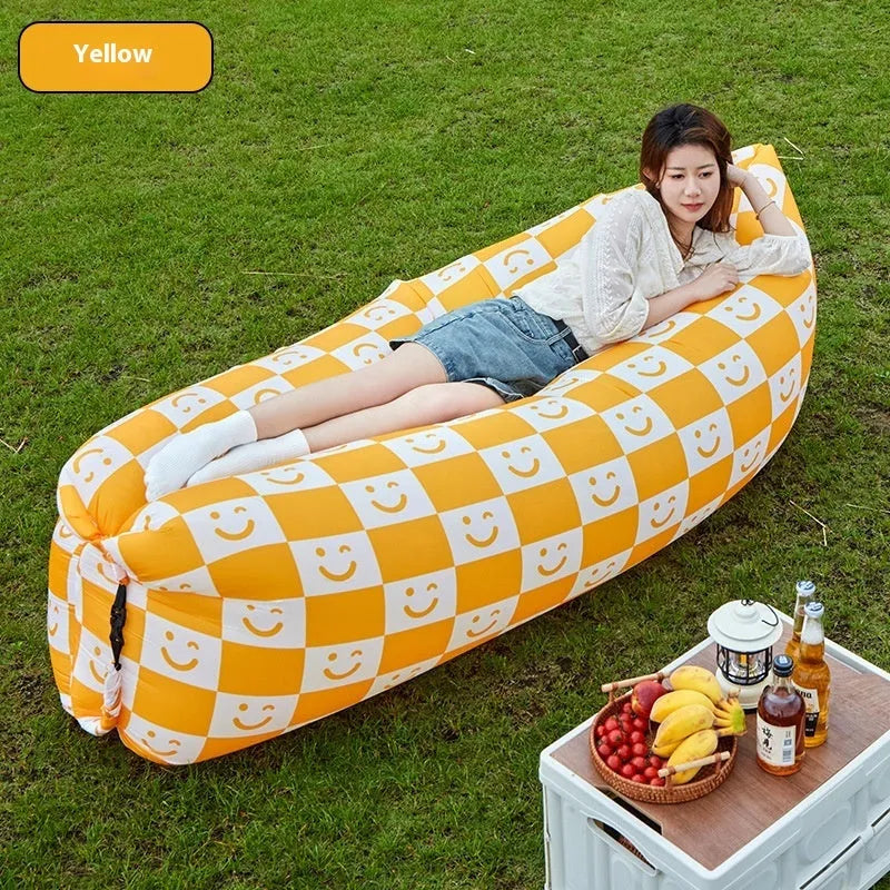 Portable inflatable sofa in folded position showing Oxford cloth material and compact 36cm x 27cm dimensions