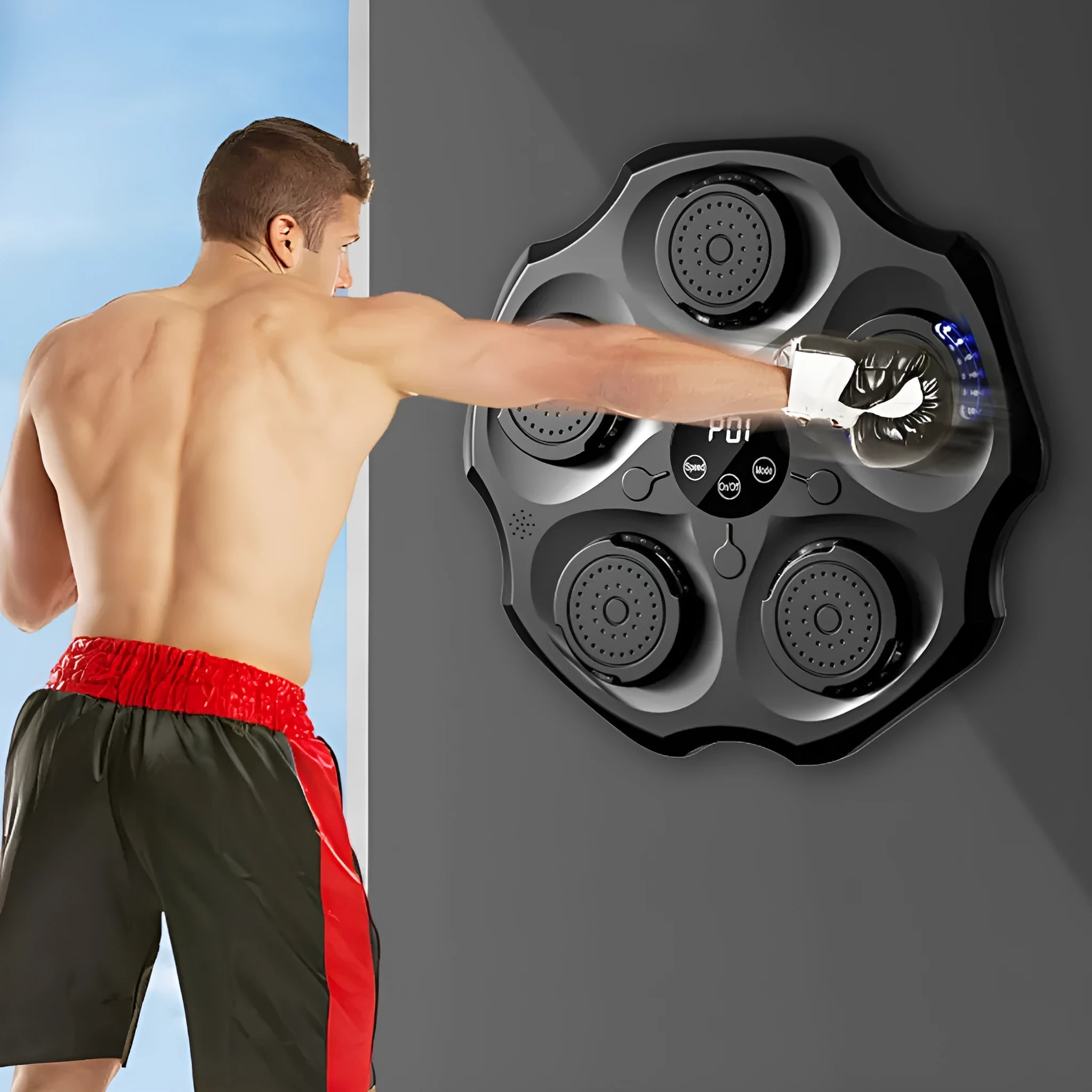 Black Bluetooth music boxing wall target hanging on a wall with included gloves.