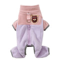 Small dog wearing a colour-block fleece jumpsuit in purple and pink, with full-zip front and leash ring