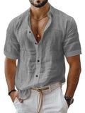 Men's solid colour short sleeve lapel shirt in light green shown on a hanger