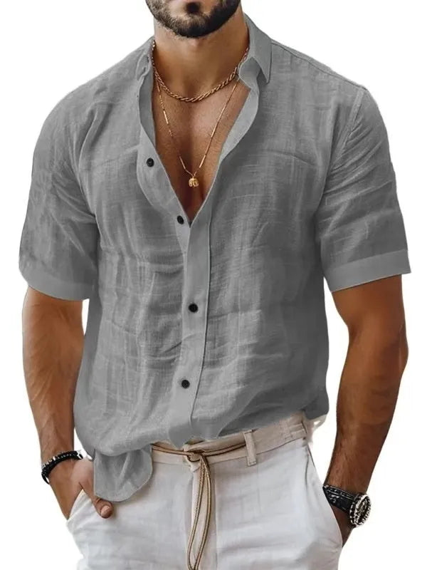 Men's solid colour short sleeve lapel shirt in light green shown on a hanger
