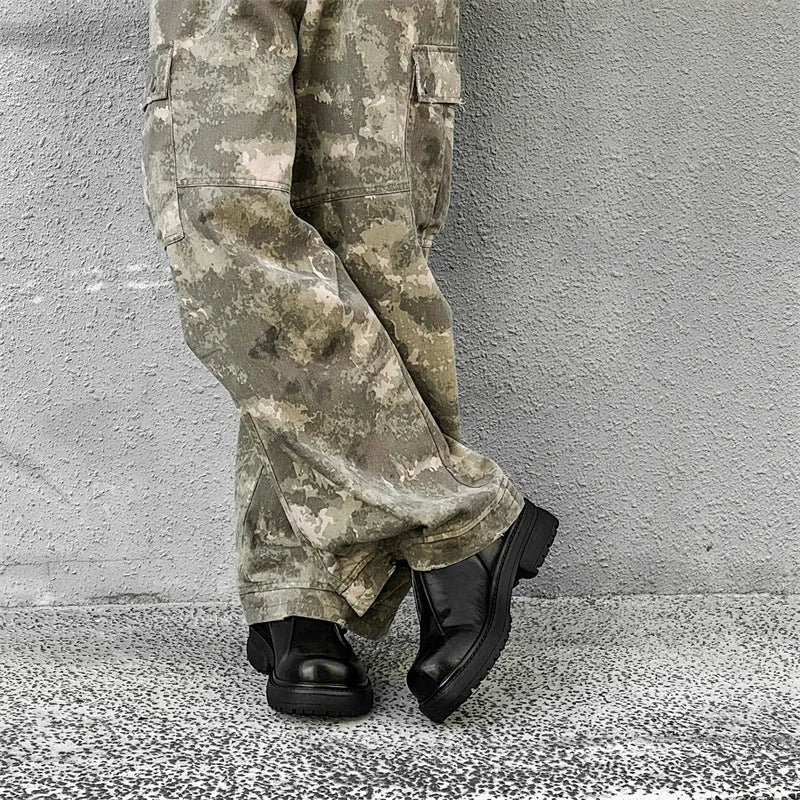 Black platform shoes with round toe and low top design for height enhancement