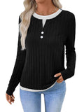 Women's black fake two-piece pullover sweater with round neck button and long sleeves on a model.