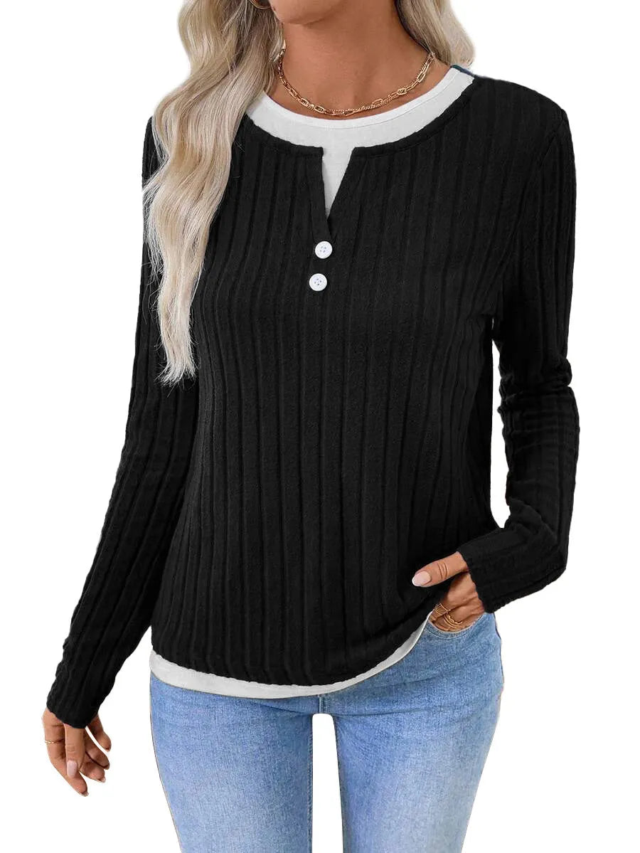 Women's black fake two-piece pullover sweater with round neck button and long sleeves on a model.