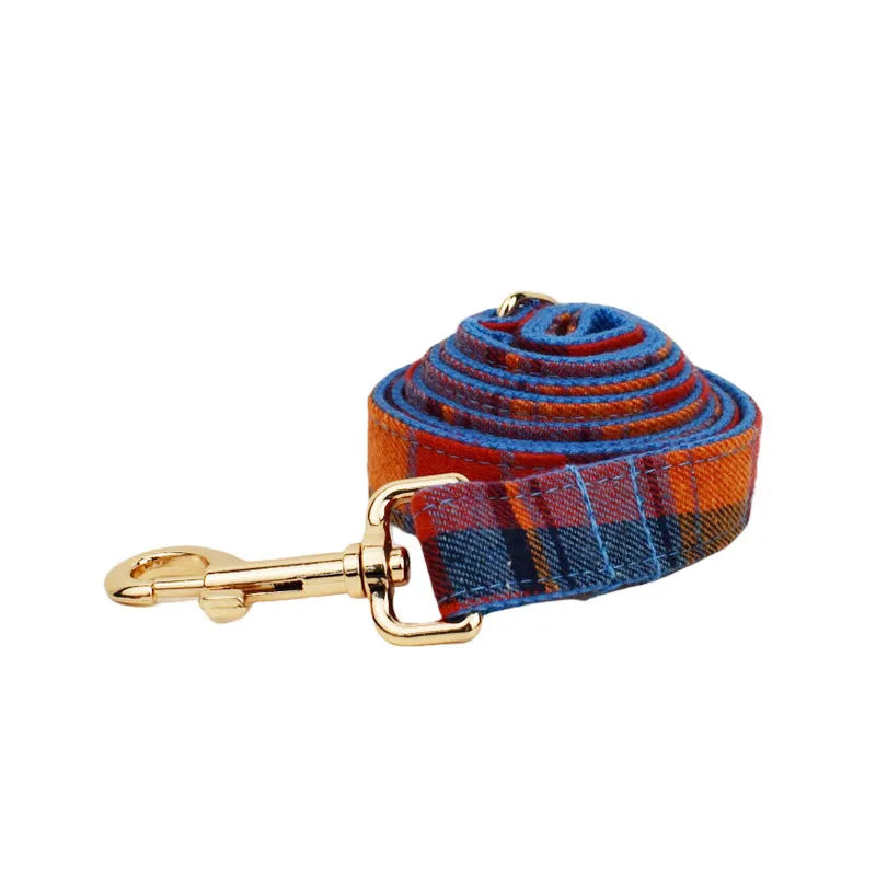 Four-piece dog accessory set with collar, leash, bow tie, and cloth vest in cloth fabric