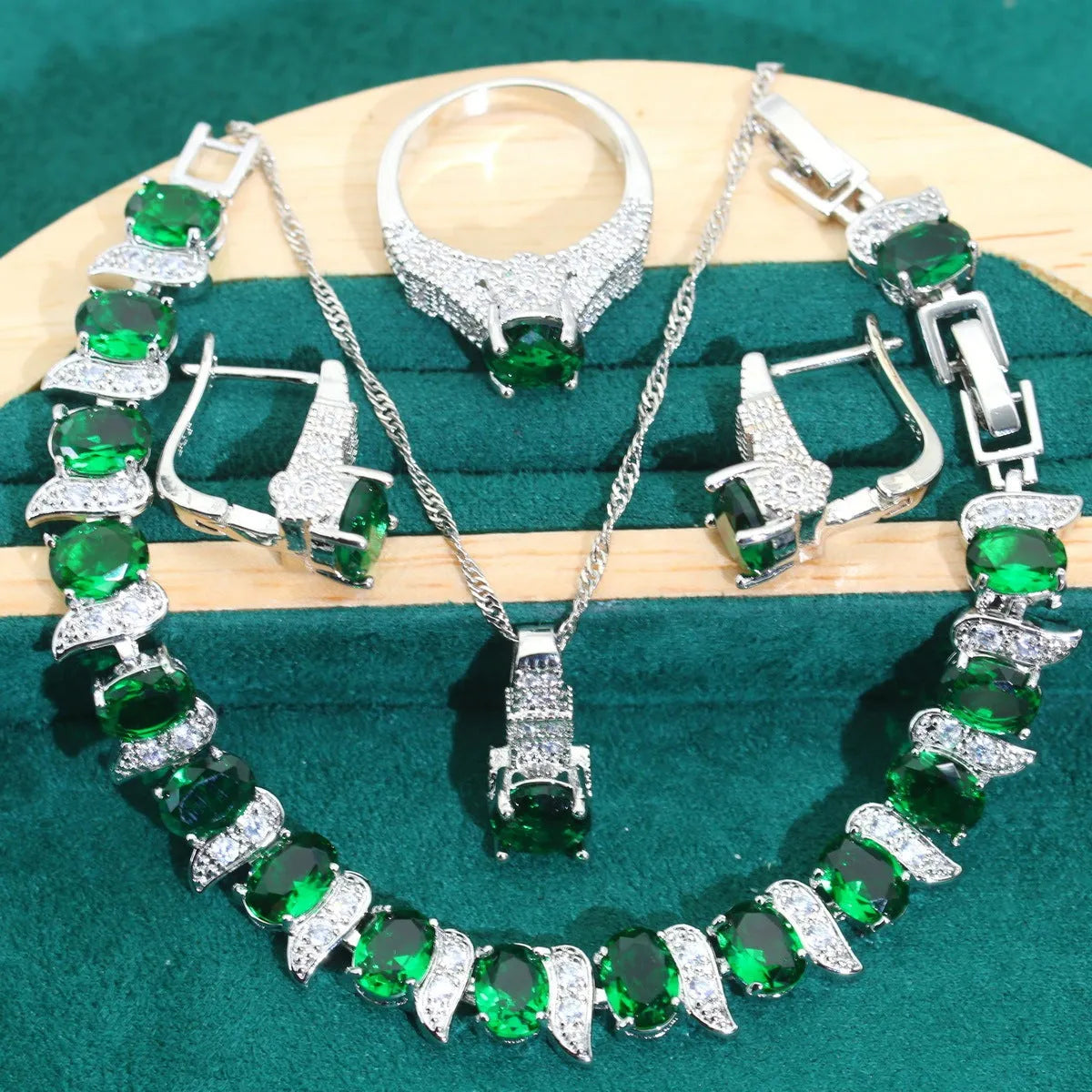 Bridal zircon jewellery four-piece set showing necklace, bracelet, earrings and ring with water wave chain